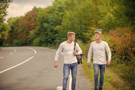 Men Backpack Walking Road Twins Walk Along Road Brothers Friends