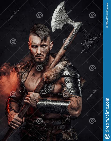 Medieval Scandinavian Barbarian With Huge Axe In Foggy Background Stock