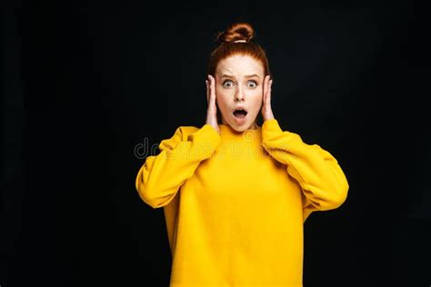 Portrait Of Shocked Afraid Young Woman Looking Excited Holding Mouth