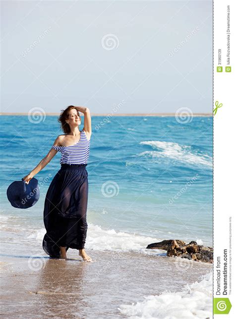 Beautiful Tanned Woman Resting On The Beach In Summer Day Stock Image