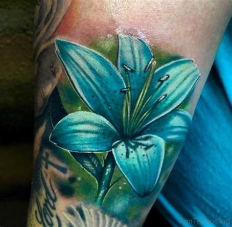 Blue Lily Tattoo Just Like The Light Highlights Beautiful Flower