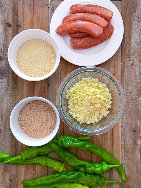 The Ingredients To Make Sausage Are Laid Out On A Wooden Surface
