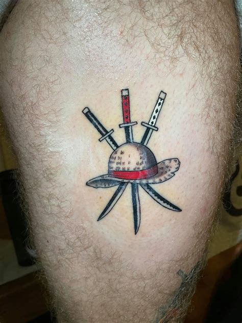 First One Piece Tattoo Luffys Hat With Zoros First 3 Swords Behind It