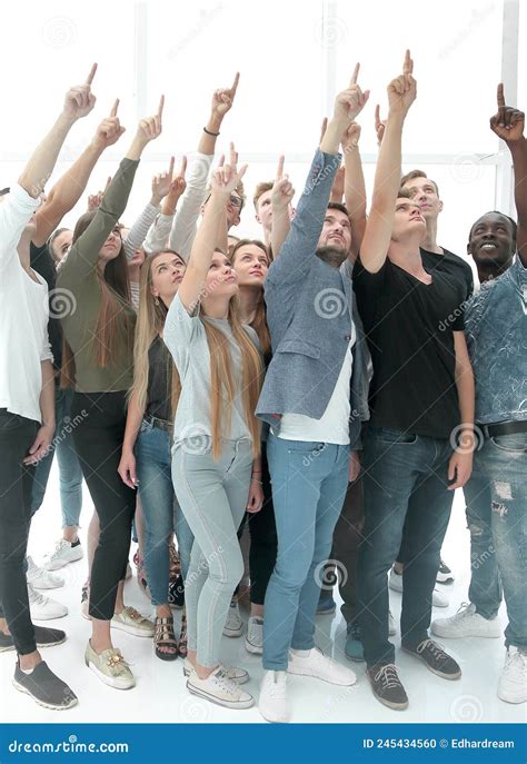 Group Of Diverse Young People Pointing Upwards Stock Photo Image Of