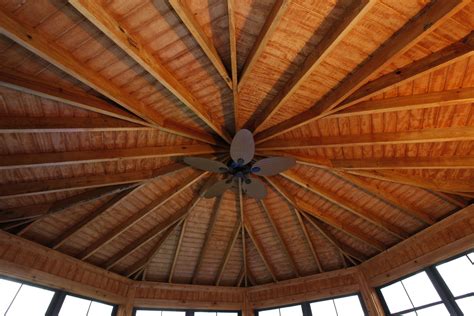 T1 11 Finished Ceiling With Exposed Rafters And A Ceiling Fan For