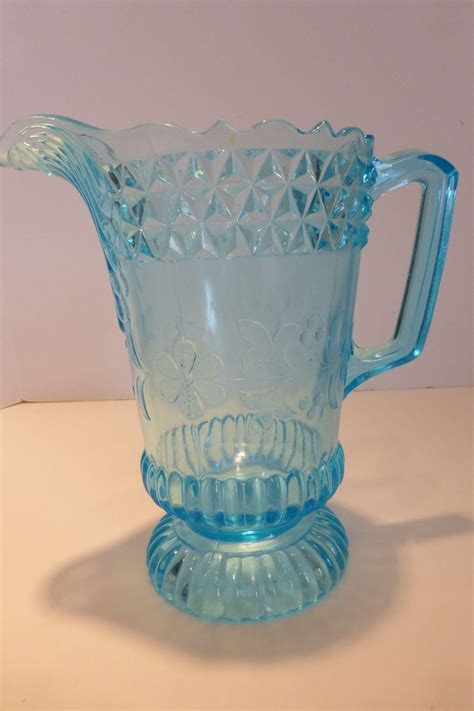The pitcher would be a big prize. A rare and beautiful large EAPG blue glass water pitcher ...