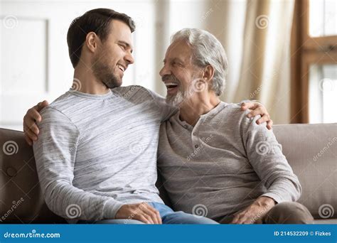 Smiling Old Dad And Adult Son Relax At Home Stock Image Image Of Home Generation 214532209