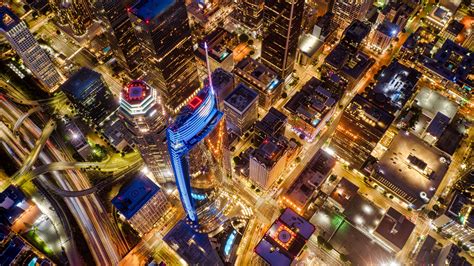 Download Wallpaper 2560x1440 Night City Buildings Glow Aerial View