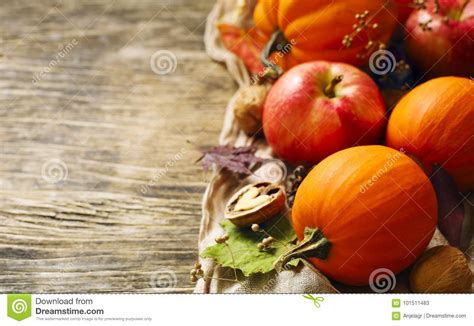 Autumn Pumpkins And Apples With Fall Leaves On Wooden Background Stock