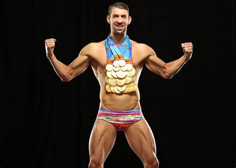 just a bunch of shots of michael phelps posing with all his olympic medals michael phelps