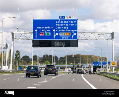 Traffic On Motorway A4 And Overhead Route Information Signs The Hague