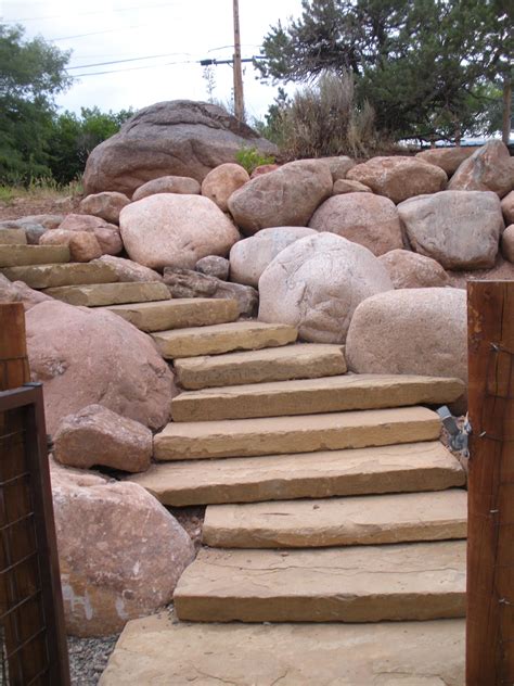 Steps And A Large Boulder Retaining Wall By Gardenhart Landscape