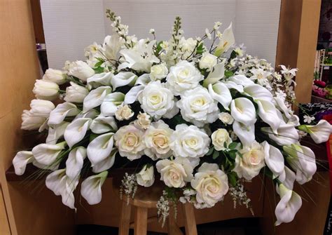 My grandfather wanted to be taken to his grave in a horse drawn hearse and so we found a funeral home. White casket topper | Memorial flowers, Funeral flower ...