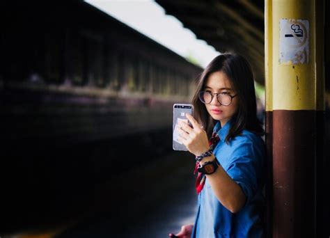 Premium Photo Young Woman Taking Selfie While Standing Railroad Station Platform