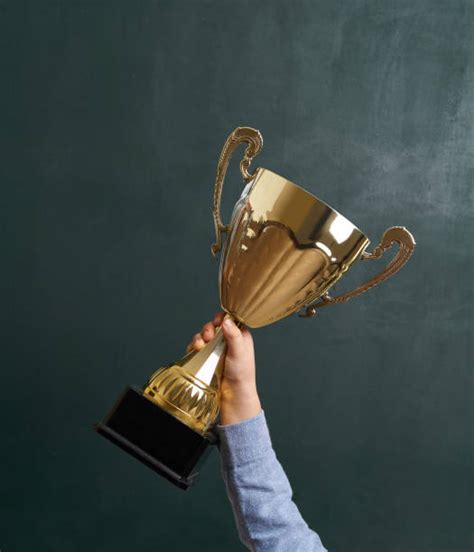 Champion Lifting Trophy Stock Photos Pictures And Royalty Free Images