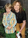 Edie Falco's son Anderson sticks his tongue out as the two pose for the ...
