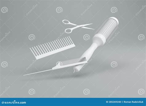 White Hairdressing Tools On A Gray Studio Background Scissors And