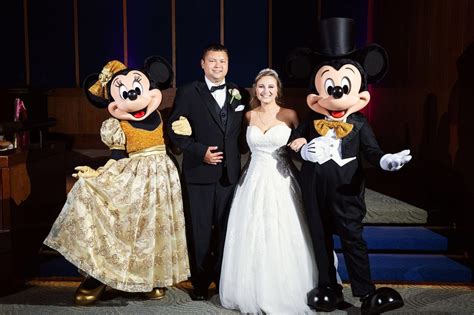 Disney Fairy Tale Wedding Bride And Groom Pose With Mickey Mouse And