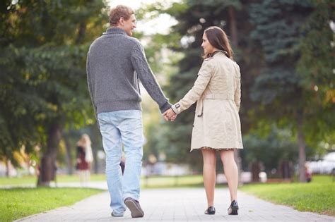 Free Photo Couple Holding Hands Walking Away