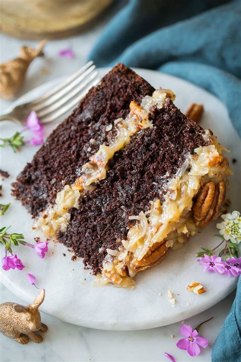 Homemade german chocolate cake, with two layers of scratch made cake, a sticky coconut pecan topping, and fudge frosting is everyone's favorite cake! german chocolate cake from scratch