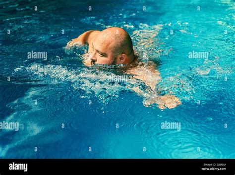 Plus Size Big Man Swimming In Pool With Blue Water Sport Activity For Health And Prevention Of