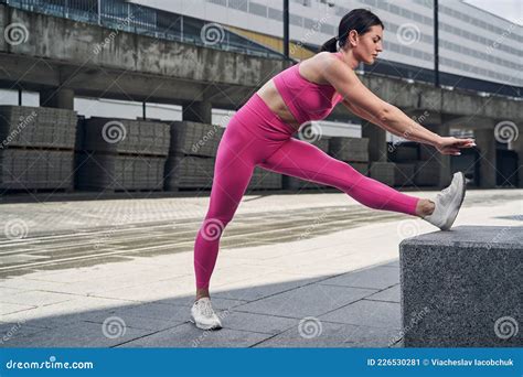 Female Bending Forward While Doing Leg Stretch Stock Image Image Of Fitness Fulllength