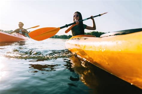 Premium Photo Couple Kayaking Low Angle View Of Beautiful Young