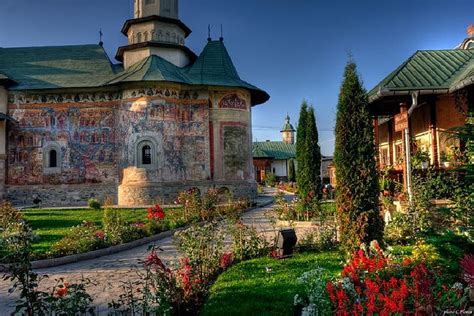 Monastery From Bucovina Romania Buildings Bushes Sky Flowers Hd