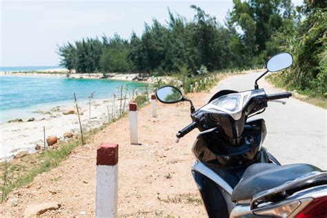 Motorcycle Standing On Sea Shore On The Way To Hai Van Pass Vietnam