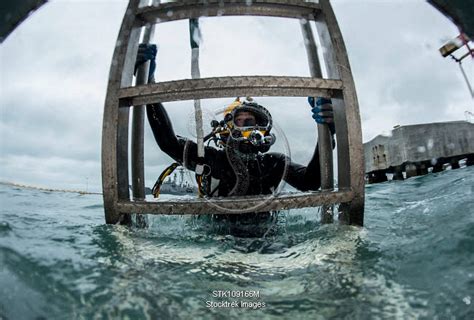 Diver Ascends A Ladder After Completing A Surface Supplied Dive