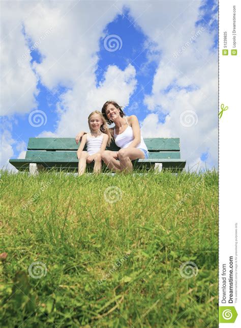 Woman With His Child Sitting On The Bench Stock Image Image Of
