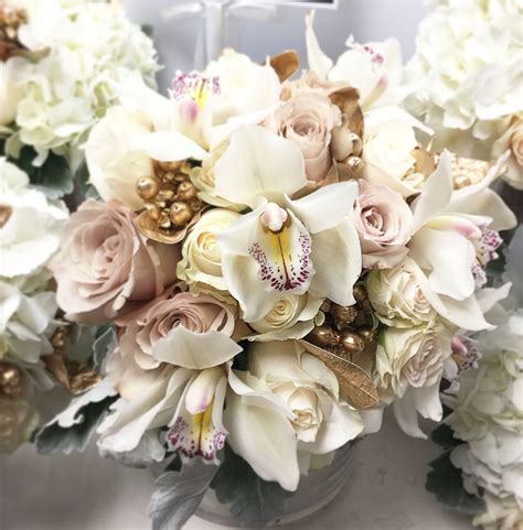 Absolutely Elegant White Cymbidium Orchids Ivory And Quick Sand Roses