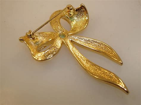 Vintage Napier Gold Tone Sparkling Rhinestone Bow Pinbrooch