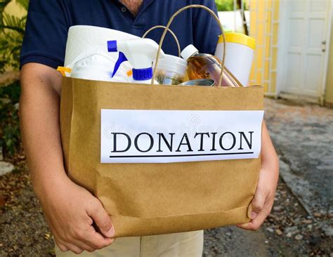 Volunteer Delivers A Donation Bag To A Home Stock Image Image Of