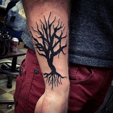 Tree Tattoo With Roots Representing Bring Grounded And Growth Roots