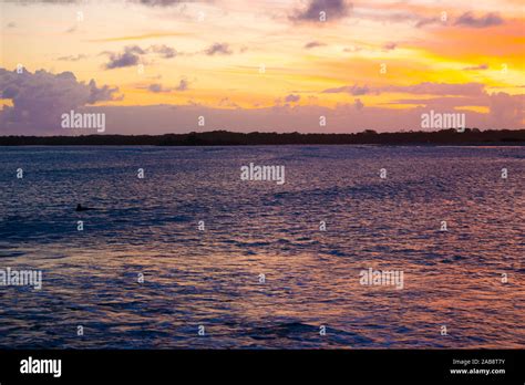 Pink Sunset Over The Water Stock Photo Alamy