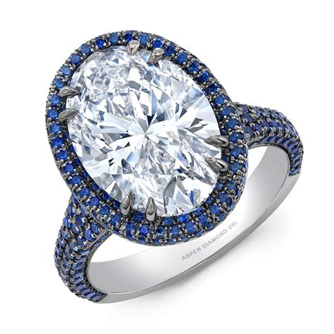 Sapphire is a member of the corundum family, a precious gemstone. Oval Diamond Sapphire Halo Engagement Ring in Platinum