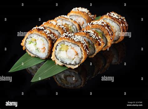 Traditional Delicious Fresh Sushi Roll Set On A Black Background With