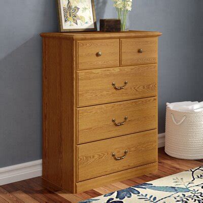 This dresser features drawers with accented knobs, and wax glides coupled with safety stops for easy access and safety. Extra Large Tall Dresser | Wayfair