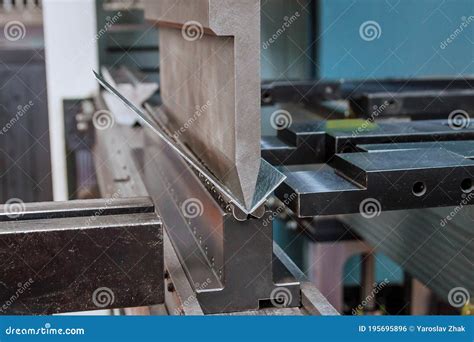 Bending Sheet Metal On A Hydraulic Machine At The Factory Close Up