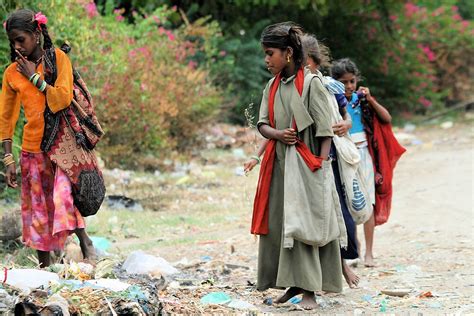 Indian Gypsy Children Looking For Something To Eat At The Rubbish Dump