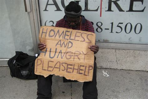 Homeless People With Sad Signs