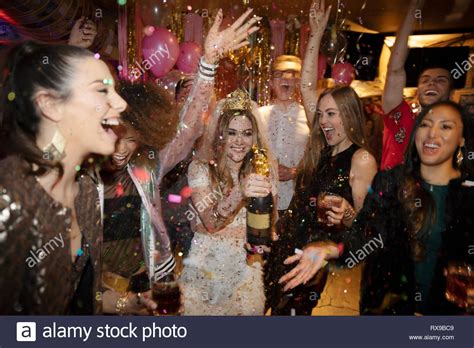 Friends Celebrating Bachelorette Party With Champagne In Nightclub
