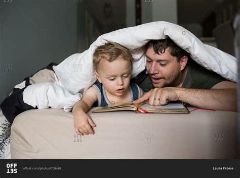Father Reading Babe Son A Bedtime Story Stock Photo OFFSET