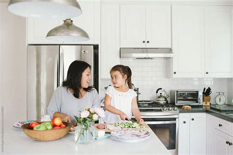Mom And Daughter Making Lunch Together In Kitchen By Stocksy Contributor Kristin Rogers