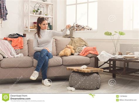 Desperate Woman Sitting On Sofa In Messy Room Stock Photo Image Of