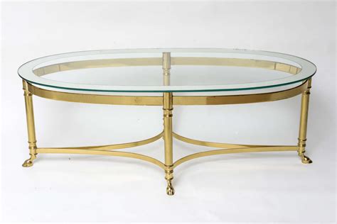Mid century modern 3 tier tubular swivel glass top table milo. Oval Brass Coffee Table with Mirrored Rim Glass Top at 1stdibs