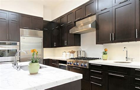 Dark wood cabinets are a timeless option to own in every type of kitchen, either modern or with a classic design. Inspiring Kitchen Cabinetry Details to Add to your Home