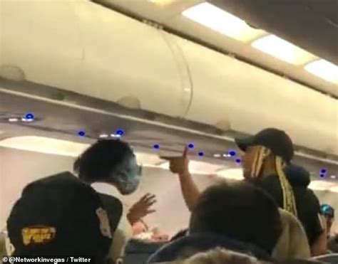 moment a spirit airlines passenger punches and kicks another woman during flight from las vegas