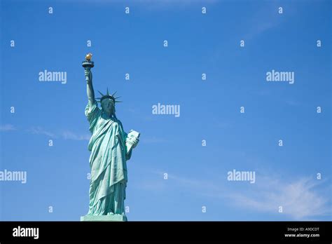 Statue Of Liberty In Sun Sunshine And Blue Sky New York City United